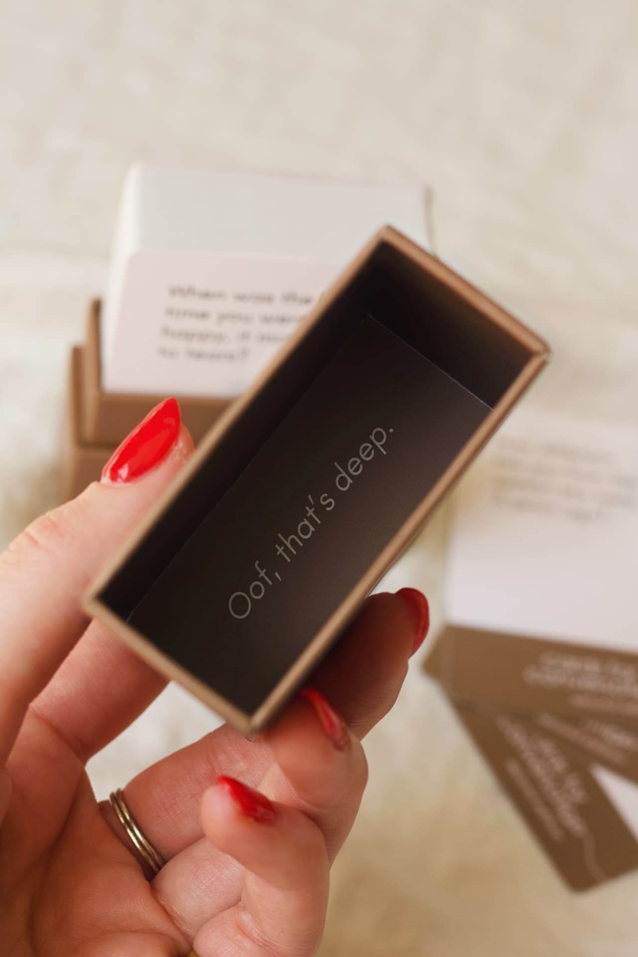 Cards for Conversation: Second Edition box interior with prompt stating 'Oof, that's deep.' for engaging discussions.