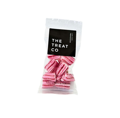 Raspberry Bonbons in a clear bag, showcasing bold pink stripes and sweet raspberry flavor.