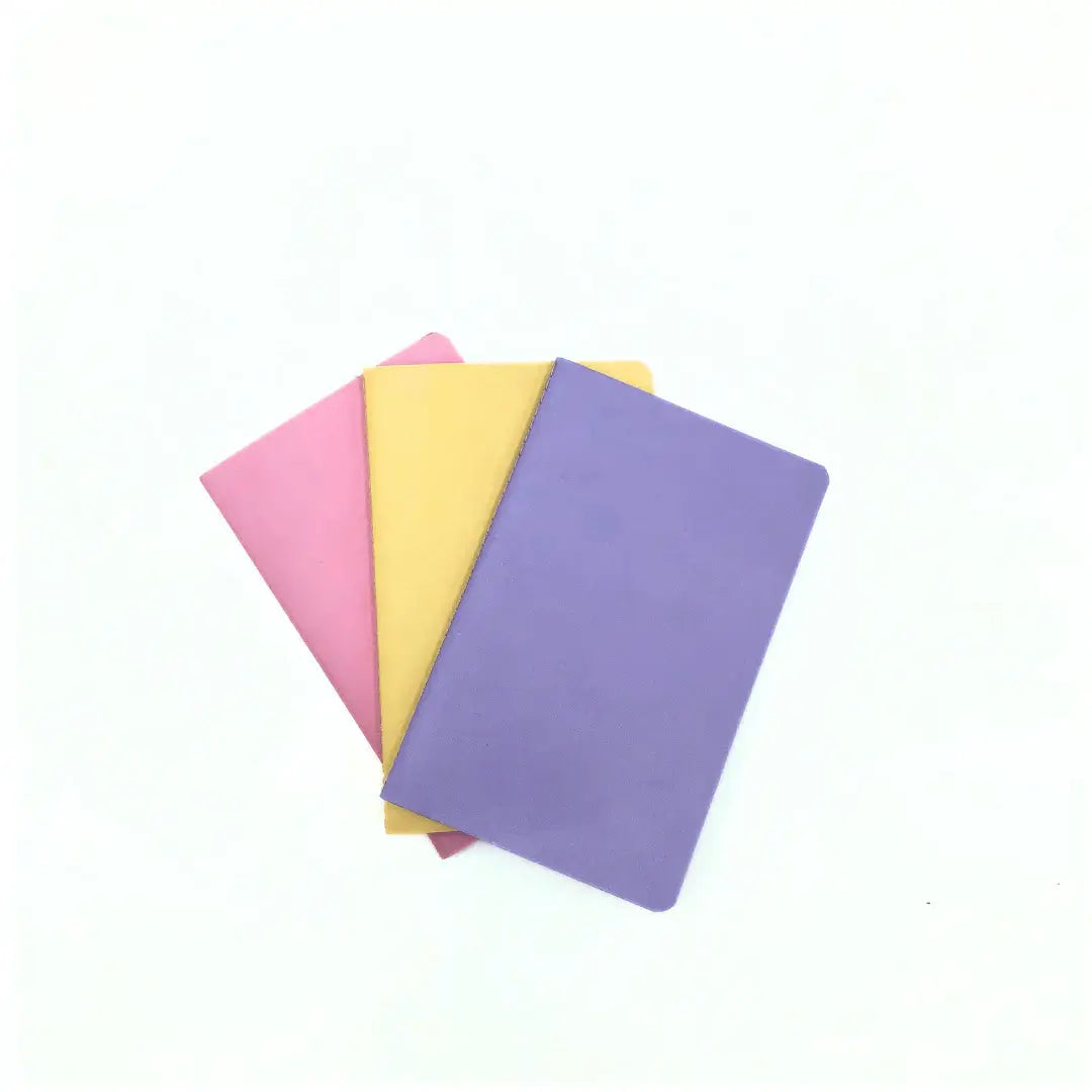 Love and macarons A6 notebooks in pastel colors: pink, yellow, and purple, ideal for stylish organization.