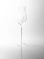 Sur La Table Textured Linear Champagne Glass 240ml with ribbed design and elongated stem.