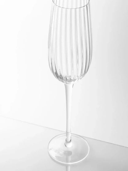 Sur La Table Textured Linear Champagne Glass 240ml with sleek ribbed design and elongated stem.